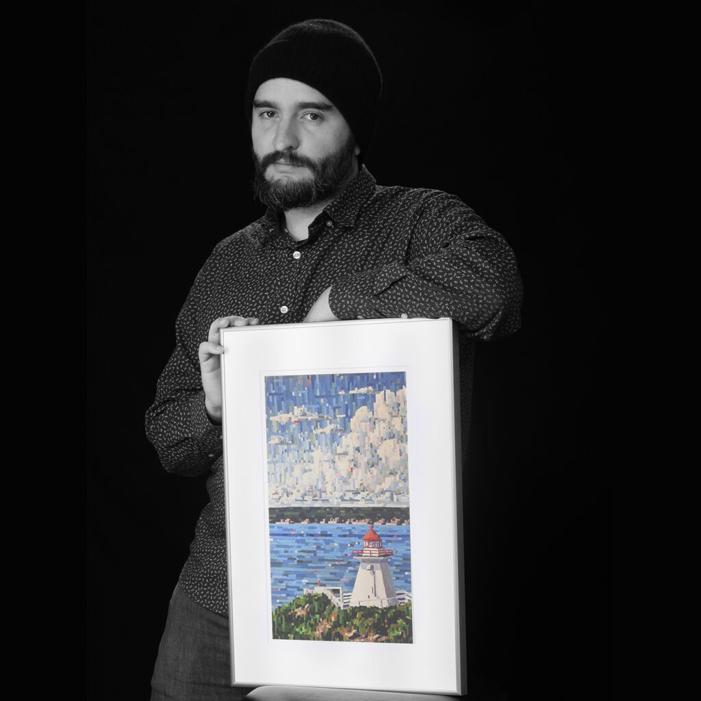 Nat Cann holding artwork