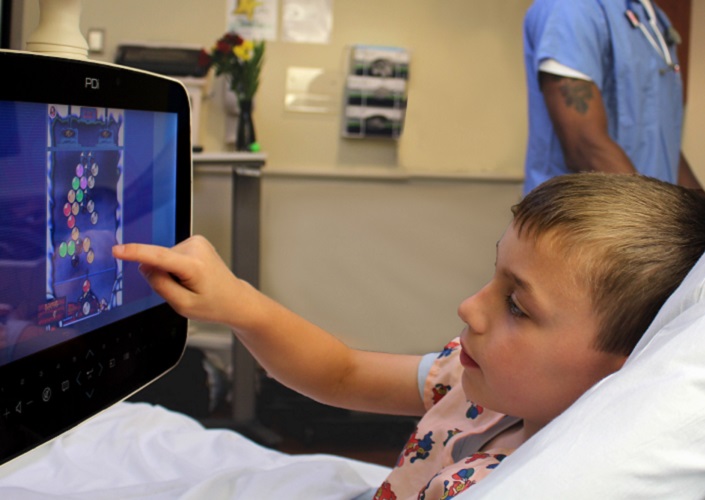 Child in hospital using a tablet